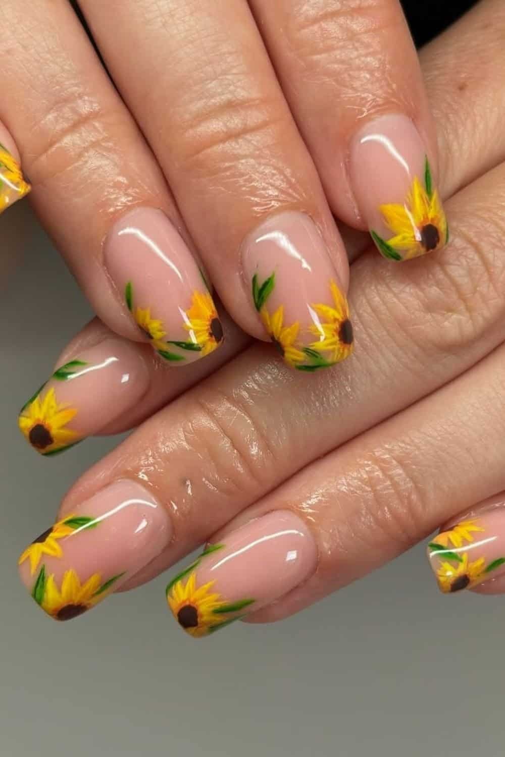 Try these sunflowers' elegant nails! The delicate combination of sunflower nail art on a soft, natural base makes them both chic and playful. With detailed floral designs at the tips, these cute sunflower nail designs add the perfect pop of sunshine to your look.